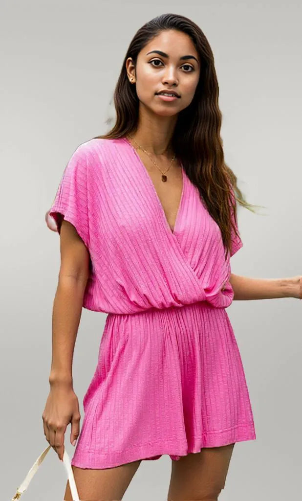 A beautiful woman wearing a pink romper