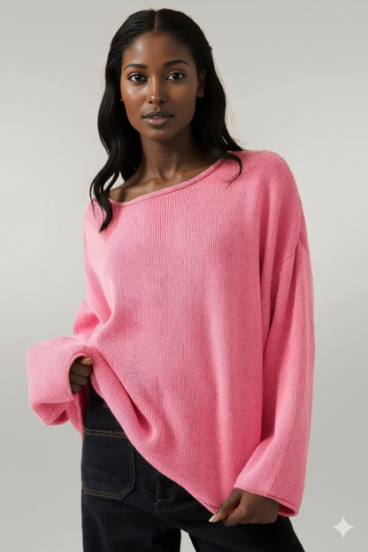 Woman wearing a pink sweater against a gray background